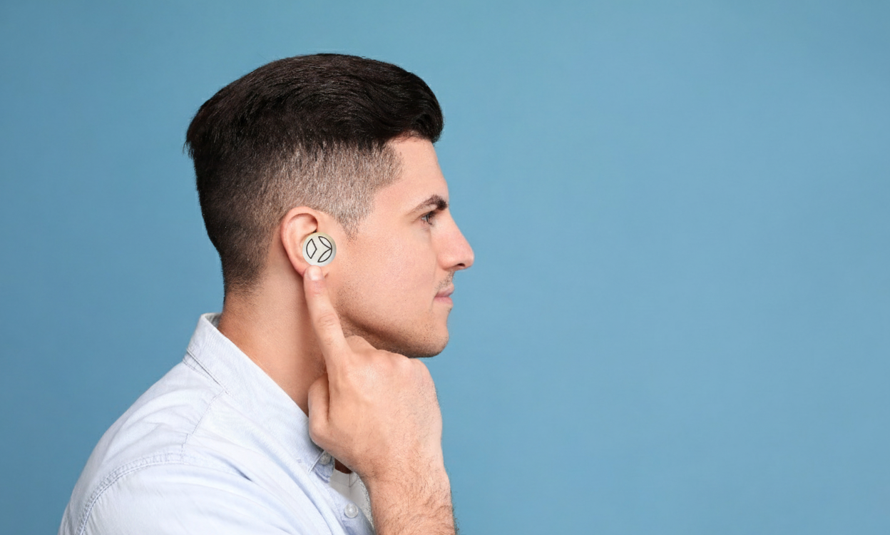 Man wearing Vagal Oh ear device for vagus nerve stimulation