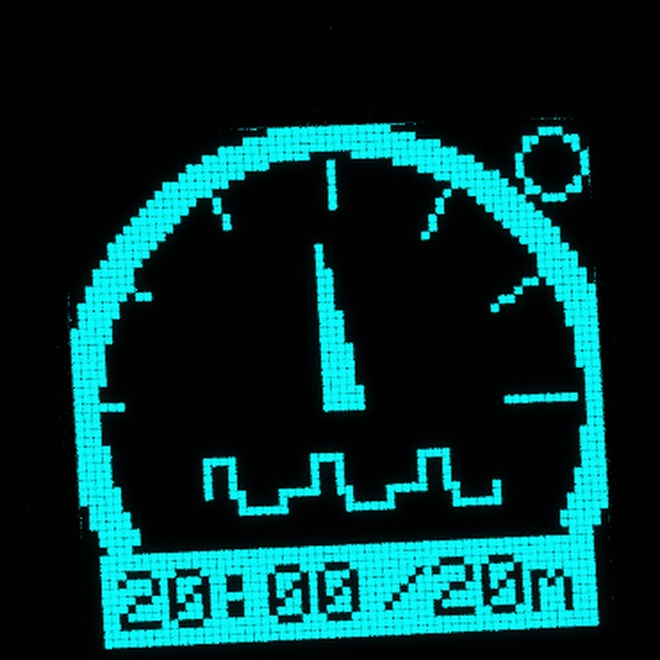 Close-up of the Vagal Buddy display showing the asymmetric waveform symbol, a tall short phase and a shallow longer return, inside the current gauge