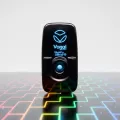 Black Vagal toner device with blue LED display on colorful circuit board pattern background - Research Edition