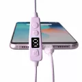 Purple Vagal Boost tENS control unit connected to smartphone showing digital display and control buttons