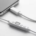 White Vagal Boost tENS control unit connected to smartphone via USB-C cable showing display and control buttons